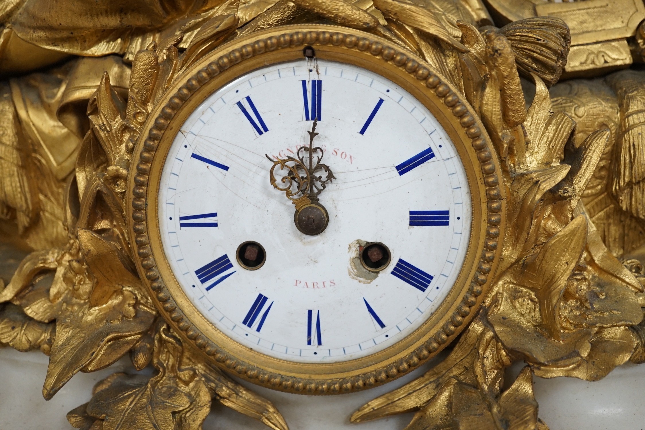 A 19th century French neoclassical revival figural ormolu and white marble clock, 39cm tall